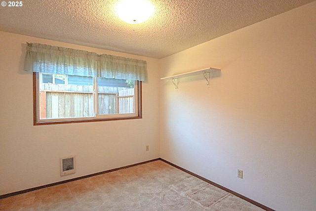 825 Seabreeze Ter, Coos Bay, OR 97420 - unfurnished room with a textured ceiling and light carpet