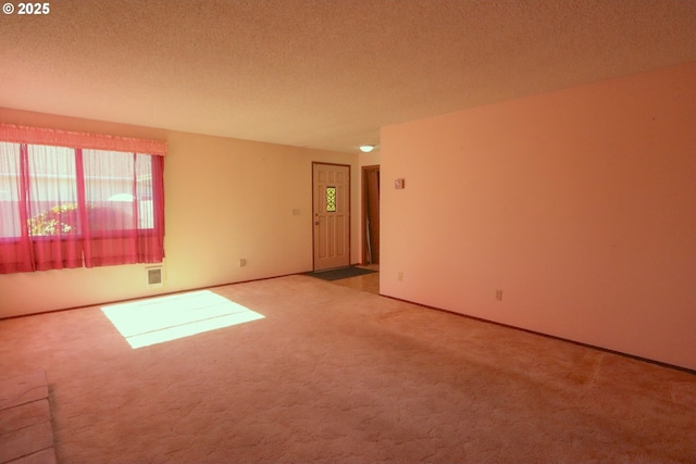825 Seabreeze Ter, Coos Bay, OR 97420 - carpeted empty room featuring a textured ceiling and baseboards