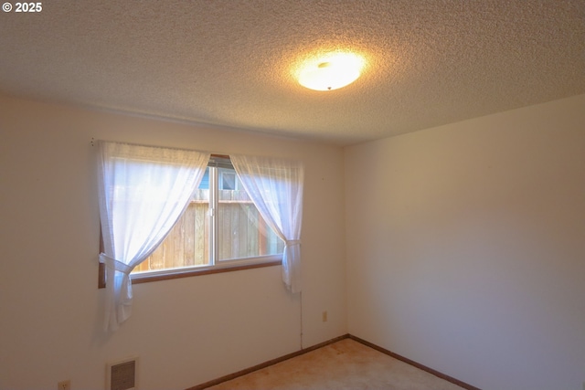 825 Seabreeze Ter, Coos Bay, OR 97420 - unfurnished room with a textured ceiling and light colored carpet