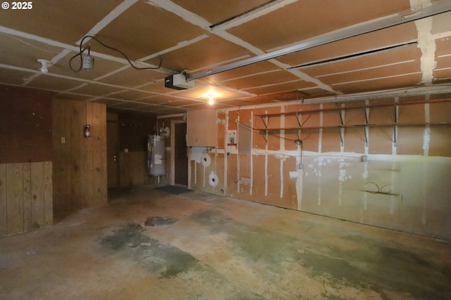 825 Seabreeze Ter, Coos Bay, OR 97420 - garage with water heater, wood walls, and a garage door opener