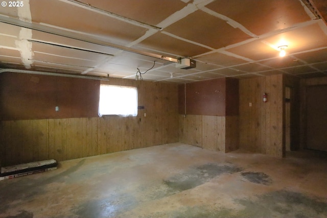 825 Seabreeze Ter, Coos Bay, OR 97420 - garage featuring wooden walls and a garage door opener