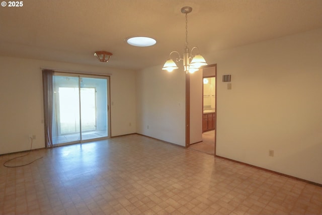 825 Seabreeze Ter, Coos Bay, OR 97420 - empty room featuring light flooring and a chandelier