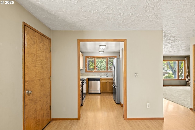 2301 SW 22nd St, Troutdale, OR 97060 - hallway featuring light wood-style floors and a textured ceiling