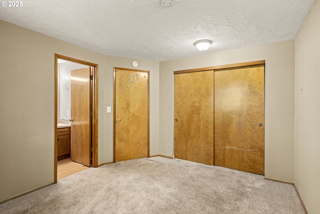 2301 SW 22nd St, Troutdale, OR 97060 - unfurnished bedroom with a closet, light colored carpet, ensuite bathroom, and a textured ceiling