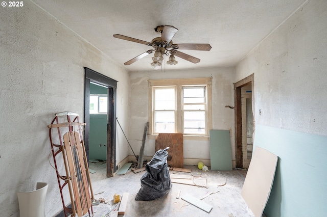 unfurnished room featuring ceiling fan