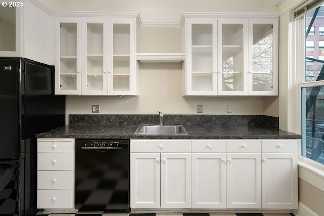 kitchen featuring crown molding, sink, white cabinets, and black appliances