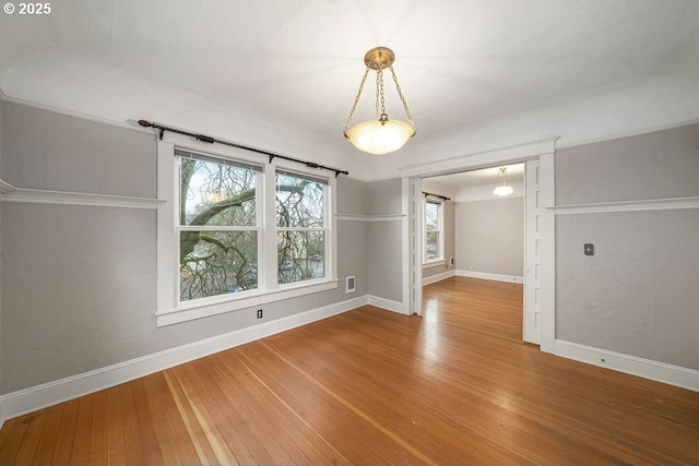 empty room featuring hardwood / wood-style flooring