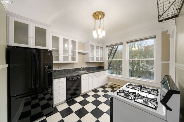 kitchen with white cabinetry, sink, an inviting chandelier, decorative light fixtures, and black appliances