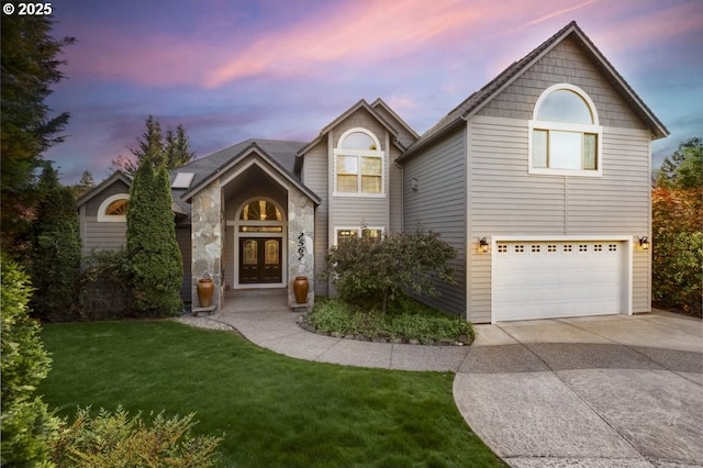 2567 SE Coriander, Grants Pass, OR 97527 - traditional-style home featuring french doors, concrete driveway, an attached garage, and a yard