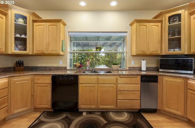 2567 SE Coriander, Grants Pass, OR 97527 - kitchen with black dishwasher, light brown cabinets, recessed lighting, glass insert cabinets, and light wood-type flooring