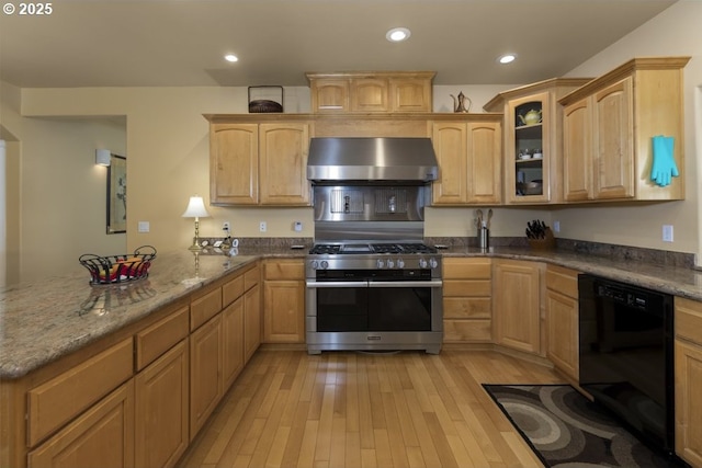 2567 SE Coriander, Grants Pass, OR 97527 - kitchen featuring black dishwasher, wall chimney range hood, double oven range, light brown cabinets, and a peninsula