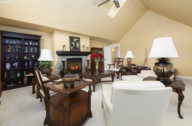 2567 SE Coriander, Grants Pass, OR 97527 - living room featuring light colored carpet, ceiling fan, lofted ceiling, a lit fireplace, and a skylight