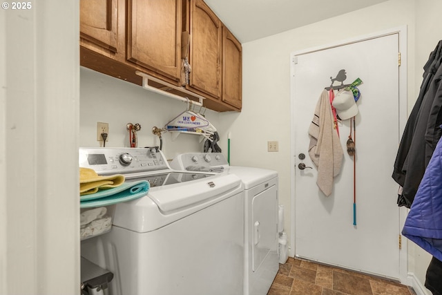 10145 SW Paulina Dr, Tualatin, OR 97062 - washroom with cabinet space, stone finish floor, and separate washer and dryer