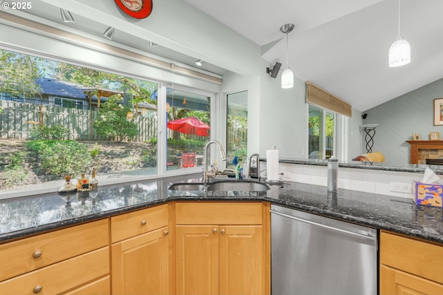 10145 SW Paulina Dr, Tualatin, OR 97062 - kitchen featuring stainless steel dishwasher, dark stone countertops, a sink, lofted ceiling, and decorative light fixtures