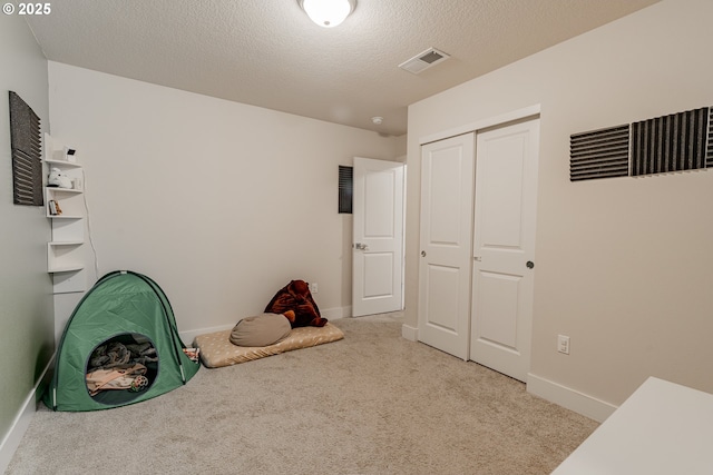 5394 SE 136th Ave, Portland, OR 97236 - playroom with carpet flooring and a textured ceiling