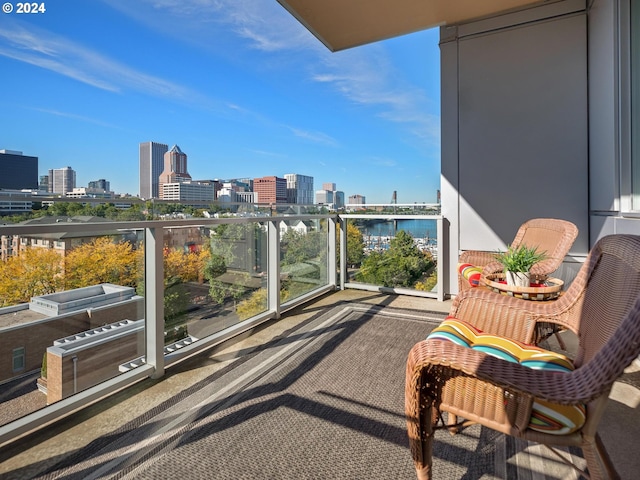 balcony featuring a water view