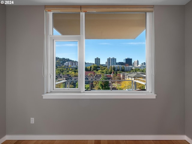 unfurnished room featuring wood-type flooring