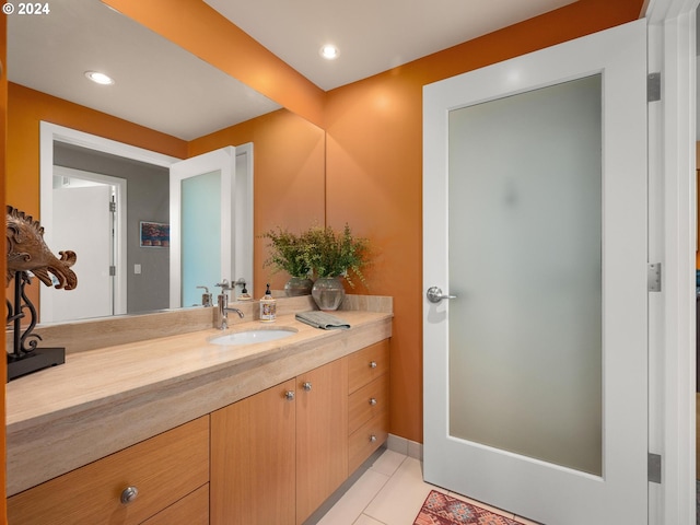 bathroom with tile patterned floors and vanity