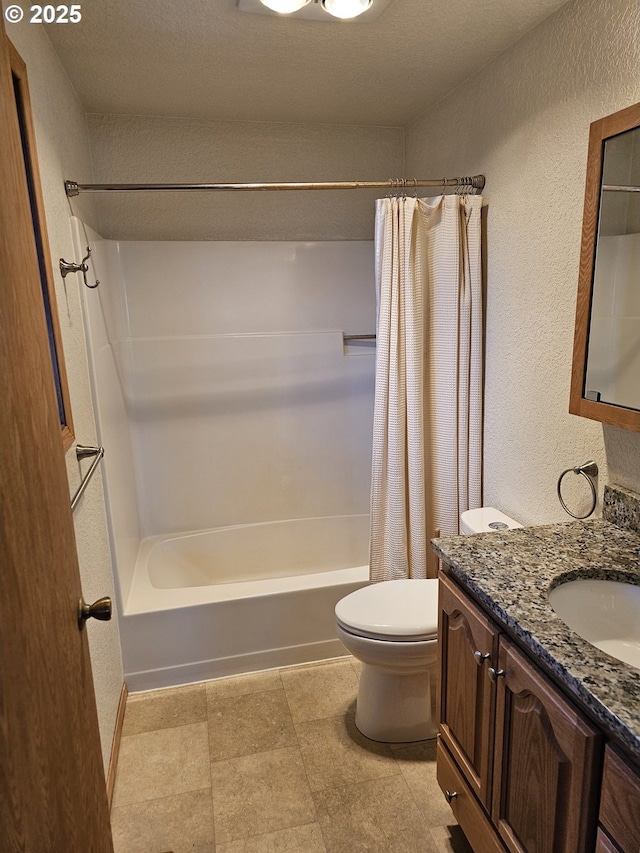 full bath with a textured wall, toilet, vanity, and shower / bath combination with curtain