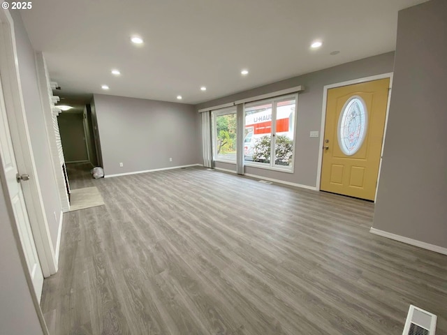 unfurnished living room featuring light wood-type flooring