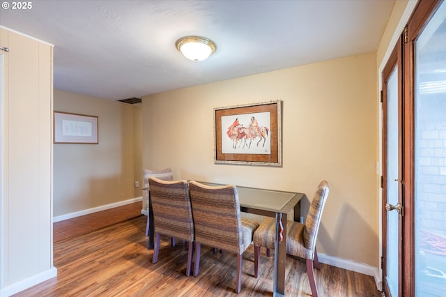 1145 Newport Ave SW, Bandon, OR 97411 - dining room featuring wood finished floors and baseboards