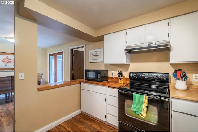 1145 Newport Ave SW, Bandon, OR 97411 - kitchen featuring black appliances, under cabinet range hood, dark wood-style floors, white cabinetry, and butcher block countertops