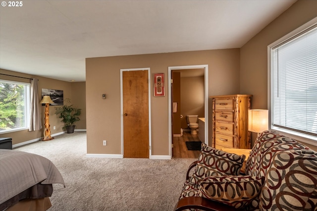 1145 Newport Ave SW, Bandon, OR 97411 - carpeted bedroom with baseboards and ensuite bath