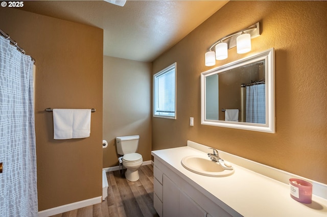 1145 Newport Ave SW, Bandon, OR 97411 - full bathroom featuring wood finished floors, vanity, and a shower with curtain