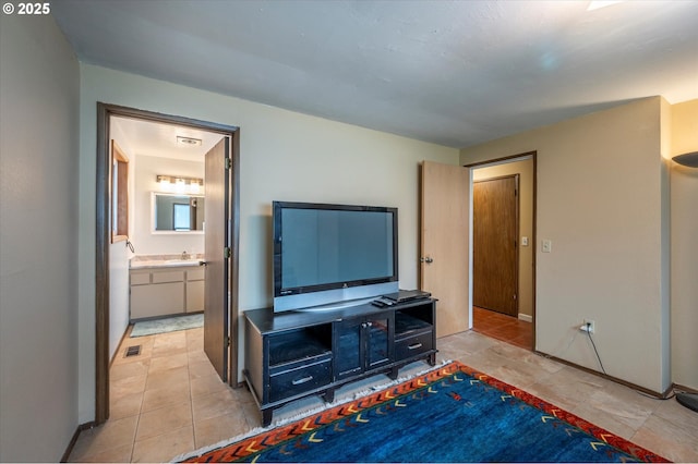 1145 Newport Ave SW, Bandon, OR 97411 - bedroom featuring ensuite bath and light tile patterned flooring