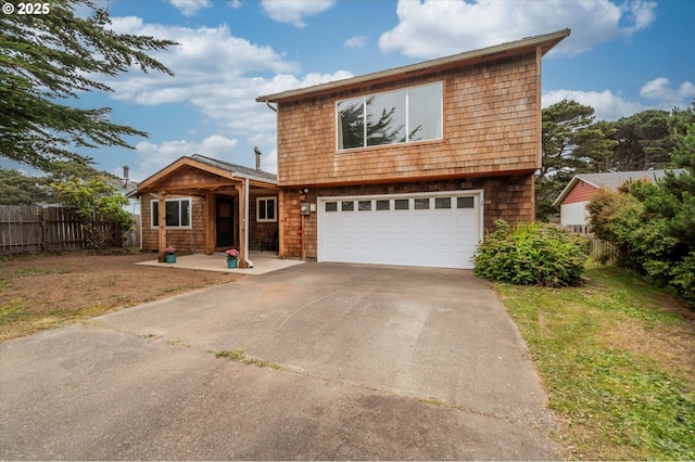 1145 Newport Ave SW, Bandon, OR 97411 - view of front of property featuring an attached garage and concrete driveway