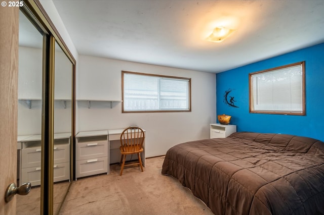 1145 Newport Ave SW, Bandon, OR 97411 - bedroom with light colored carpet, a closet, and built in desk