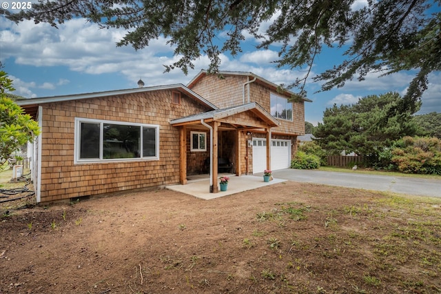1145 Newport Ave SW, Bandon, OR 97411 - view of front facade featuring concrete driveway and an attached garage