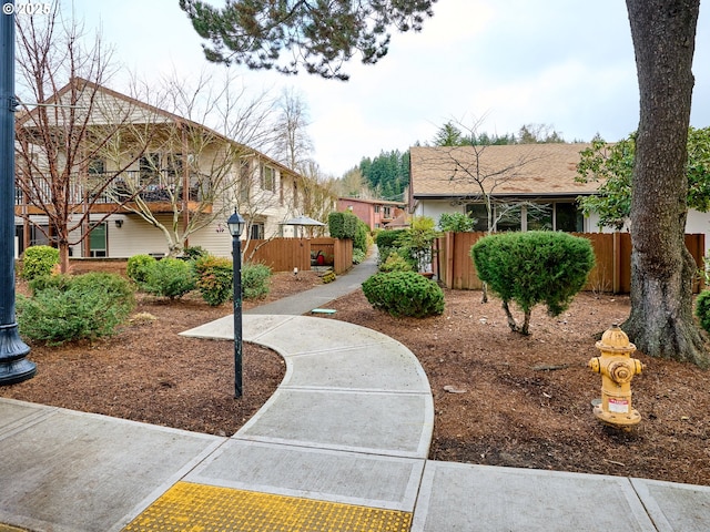 view of home's community with fence