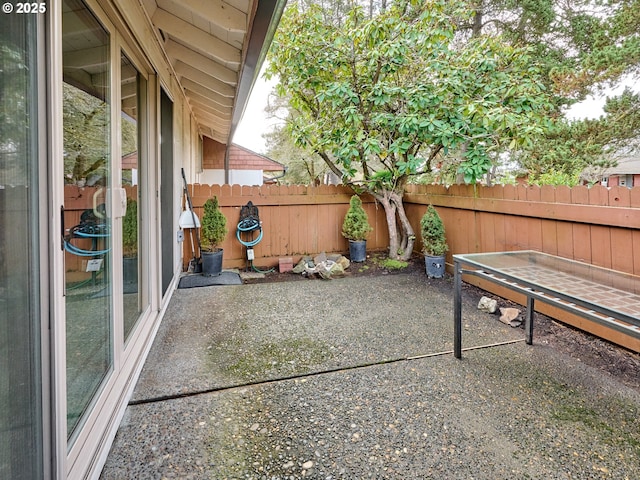 view of patio featuring fence