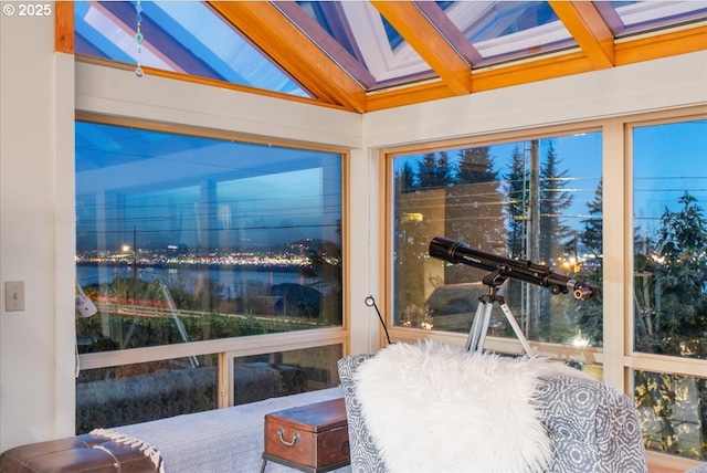 sunroom / solarium with lofted ceiling with beams