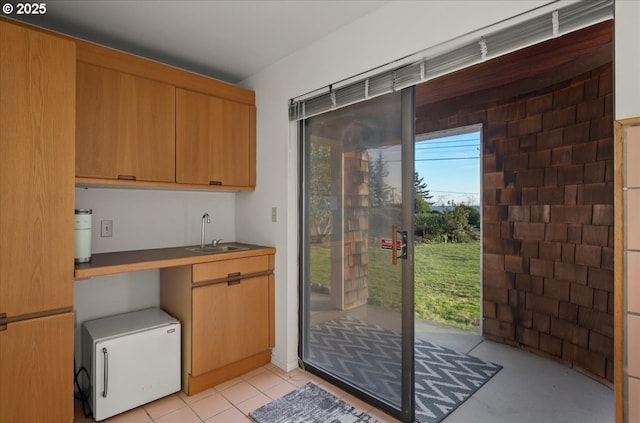 kitchen with fridge and a sink