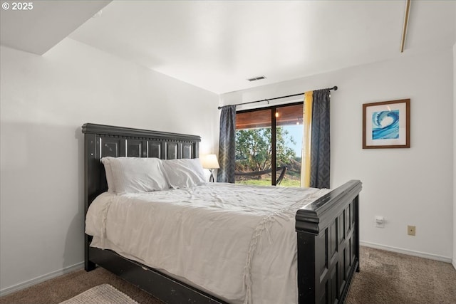 carpeted bedroom with visible vents and baseboards