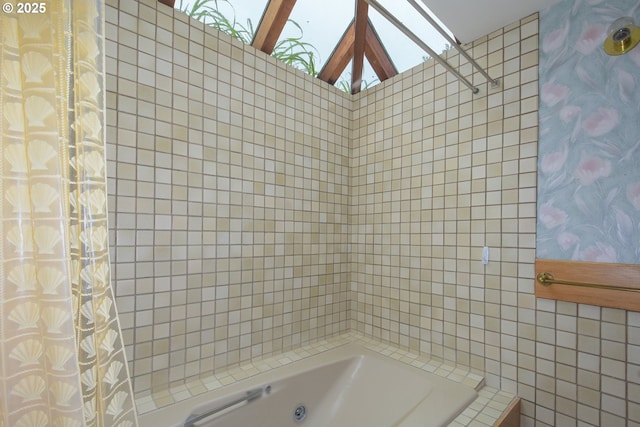 full bath with tile walls and shower / bath combination with curtain