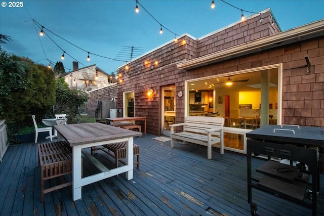 wooden deck with outdoor dining space