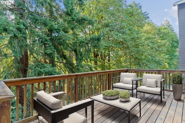 wooden deck with an outdoor living space