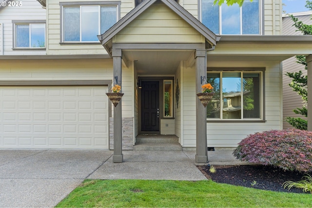 doorway to property featuring a garage