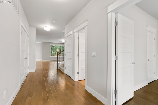 28340 SW Mcgraw Ave, Wilsonville, OR 97070 - hall with wood finished floors, stairway, and baseboards