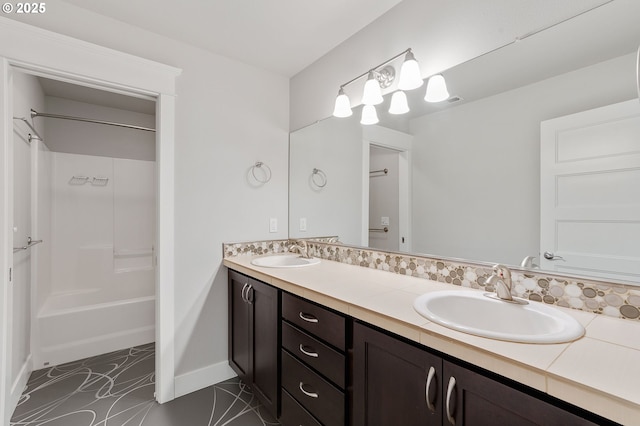 bathroom featuring shower / tub combination, tile patterned flooring, and vanity