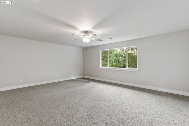 empty room with carpet flooring and ceiling fan