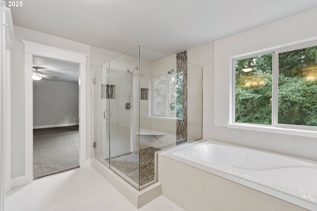 bathroom with ceiling fan, shower with separate bathtub, and a wealth of natural light