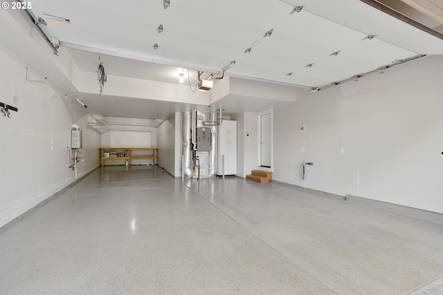 28340 SW Mcgraw Ave, Wilsonville, OR 97070 - garage featuring water heater, a garage door opener, and electric panel