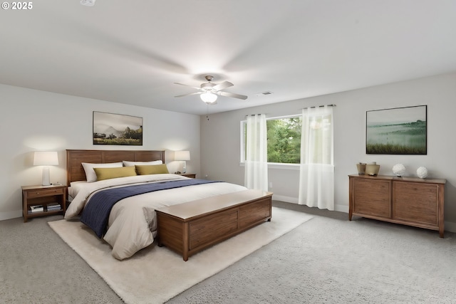 bedroom featuring ceiling fan and light carpet