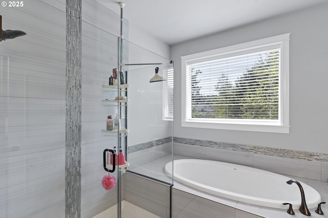 full bathroom with a garden tub and a stall shower