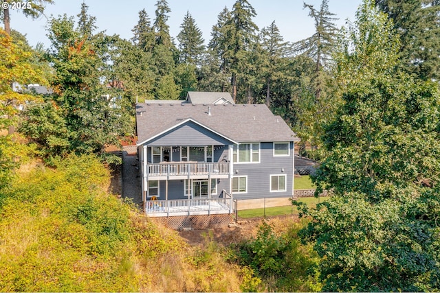 back of property featuring a balcony