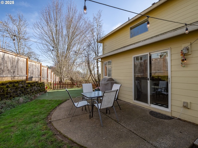 view of patio featuring fence